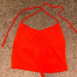 Orange tank top.